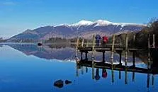 an image of a jetty and skiddaw at derwentwater, the third largest of the lakes in the Lake District