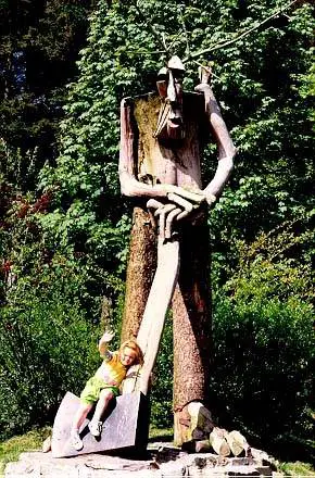 close up image of sculpture of a figure with an axe
