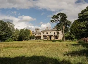 The New Georgian Era, luxury villa in front of a meadow.