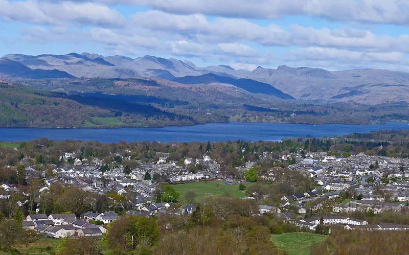 image of the view overlooking windermere village with the Coniston hills beyond