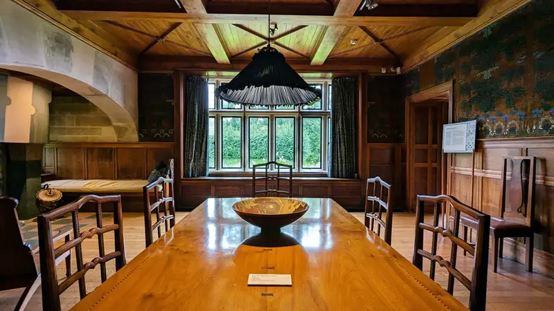 image of the Dining Room, photo shows wooden table and window in the background