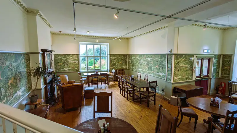image of the cafe, photo shows a comfortable room with nice wooden tables