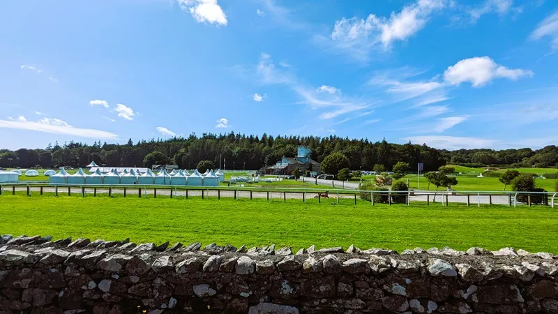 image of cartmel racecourse, with blue sky in the background
