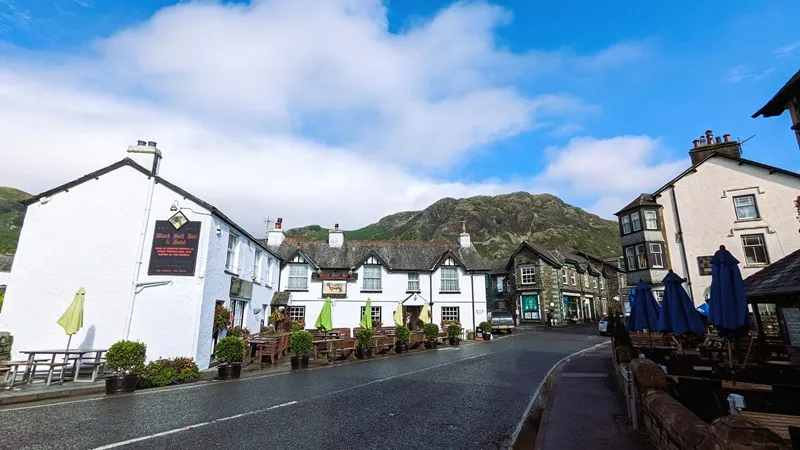 image of the Old Man of Coniston viewed behind the hisoric Black Bull Inn
