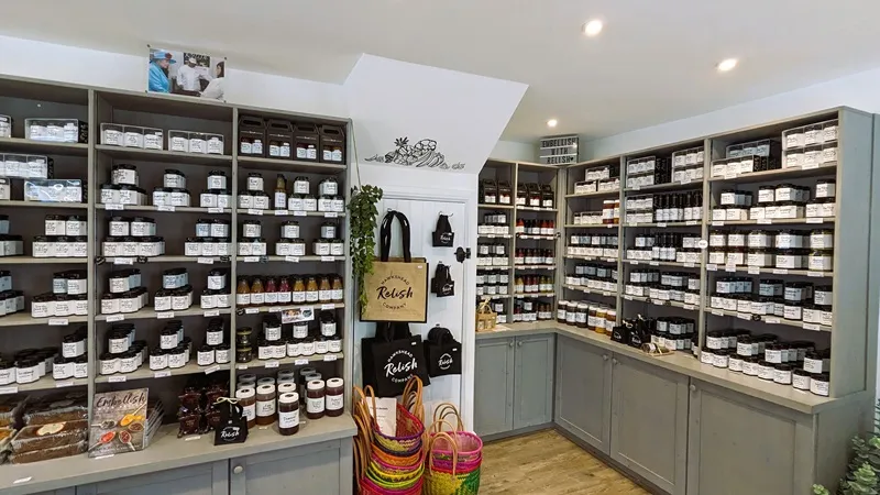 image of the shelves full of jars of relishes and jams