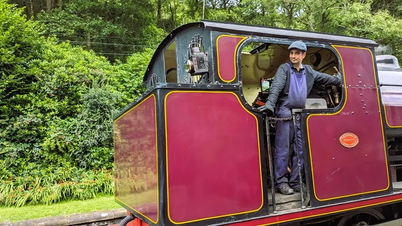 Image of the the train driver bringing the train into haverthwaite station