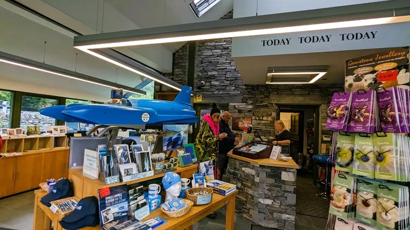 image of the gift shop at the museum, photo shows a couple buying some souvenirs.