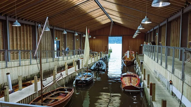 image the boathouse that include several classic and heritage boats including the small sailboats Swallow and Amazon