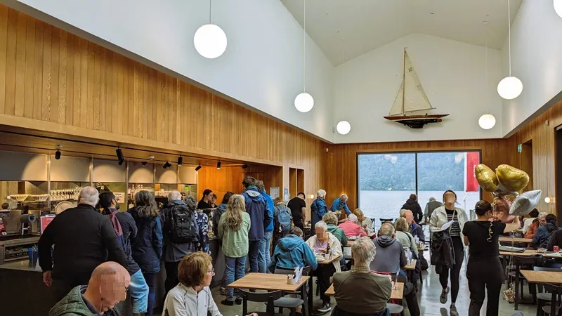 image of The cafe at the Windermere Jetty Museum, photo shows a busy cafe with the lake in the background