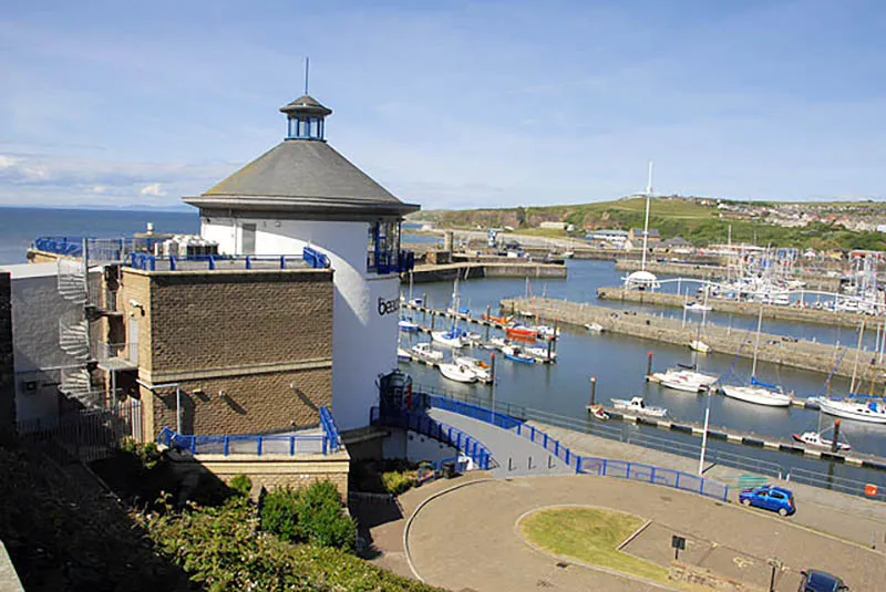 image of the beacon museum with whitehaven harbour, and boats, beyond